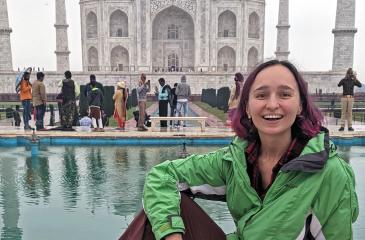 Christina Daragan sitting in front of the Taj Mahal