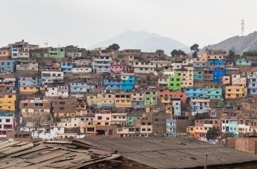 Colorful houses dot the hills of Cerro San Cristobal, Lima, Peru