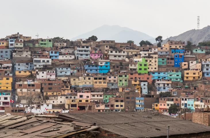 Colorful houses dot the hills of Cerro San Cristobal, Lima, Peru